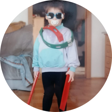 me wearing a snapback hat backwards, raising my right finger as if I just had a great idea. I have a smirk on my face.